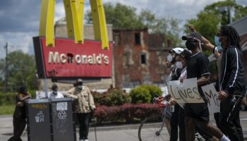 Black Lives Matter protesters march past a Philadelphia McDonald's restaurant.