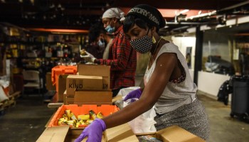 Workers at Brownsville's Collective Fare assemble donated to-go meals. Many residents of the neighborhood are essential workers and more exposed to risk.