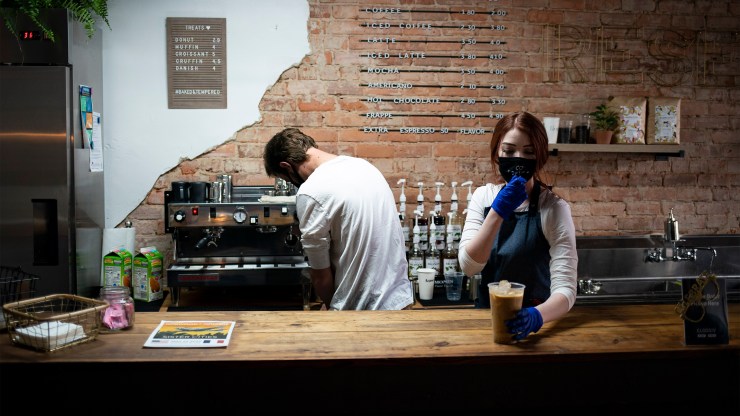 Baristas prepare drinks at a coffee shop in May in North Carolina.