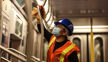 A cleaning crew disinfects a New York City subway car. Much of the money states received from the federal government has gone toward preventing the spread of the coronavirus.