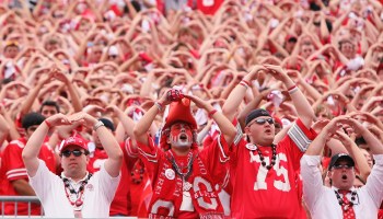 Fans cheer the Ohio State University Buckeyes at a 2008 game. In one year, sports brought in $209 million to the school.