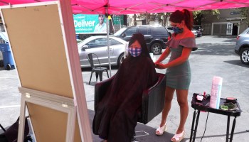 Insignia Hair Salon reopened its doors to clients for haircuts a day after California Gov. Gavin Newsom announced guidance for barbershops and hair salons to offer haircuts in an outdoor setting.