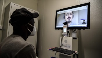 A patient attends a teleconsultation on suspicion of COVID-19 at a special medical unit in Paris in May.