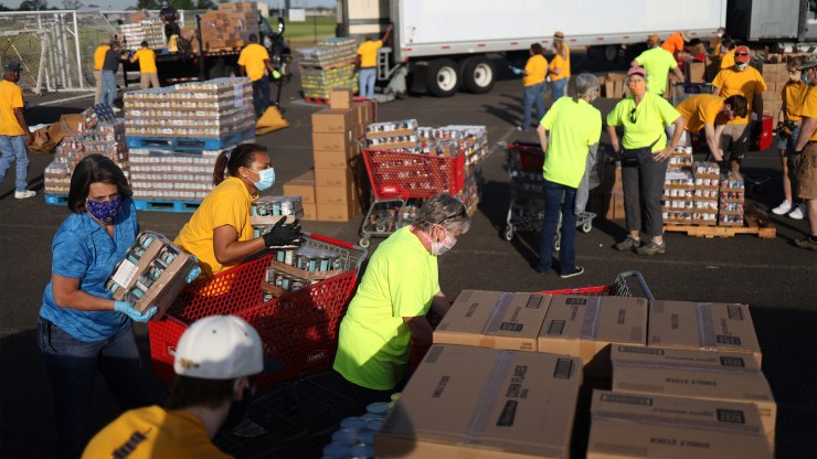 Volunteers in Virginia organize food distribution to families in need.