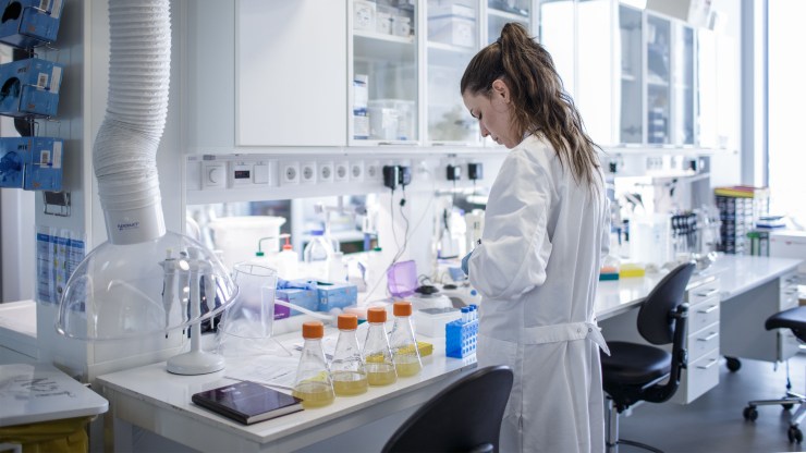 A researcher works on a vaccine for COVID-19 at the Copenhagen University research lab in Denmark in March.