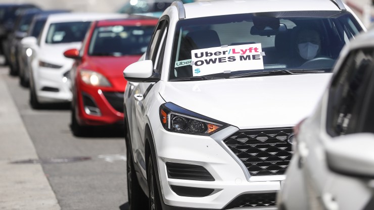 Uber and Lyft drivers with Rideshare Drivers United and the  Transport Workers Union of America conduct a "caravan protest" outside the California Labor Commissioner’s office amid the coronavirus pandemic on April 16, 2020 in Los Angeles, California.
