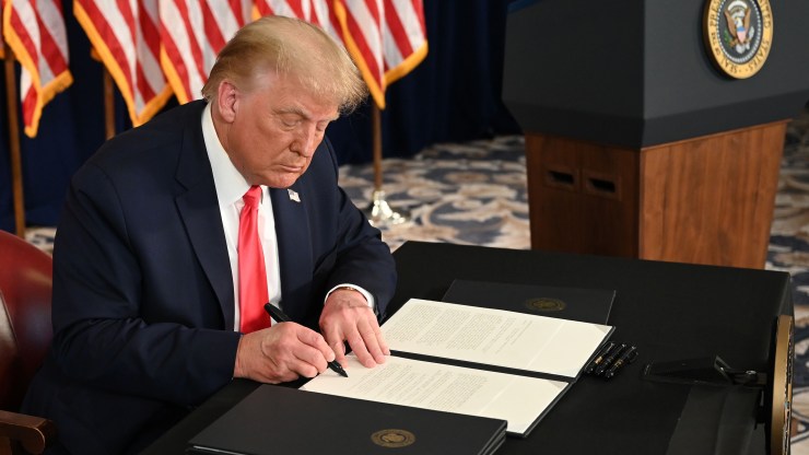 President Donald Trump signs executive actions extending coronavirus economic relief on Aug. 8.