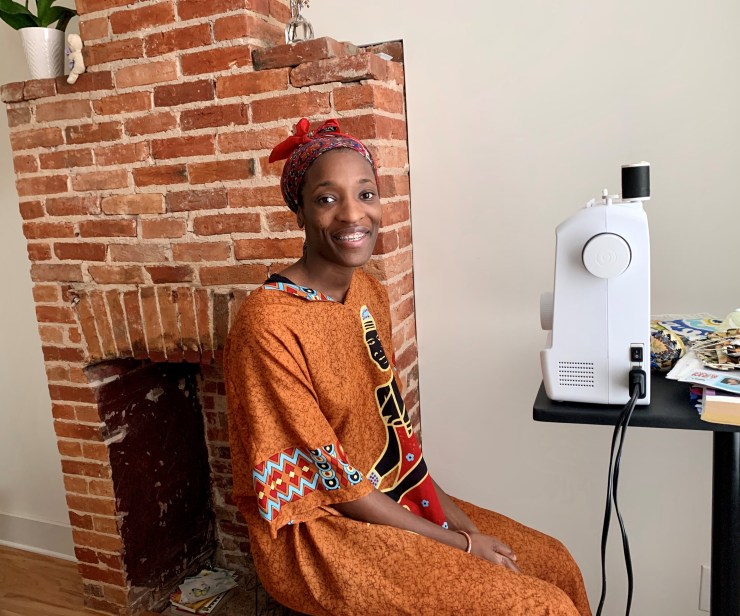 Henderson set up her sewing machine by the restored fireplace in her new house.