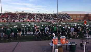 A Northwest Missouri State University football game in 2019 with a large crowd of spectators.