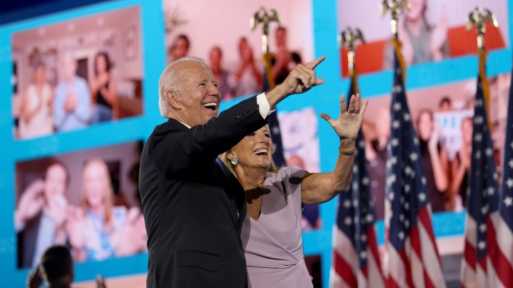 Democratic presidential nominee Joe Biden and his wife, Jill, wave to supporters via video conference on the fourth night of the Democratic National Convention in Wilmington, Delaware.