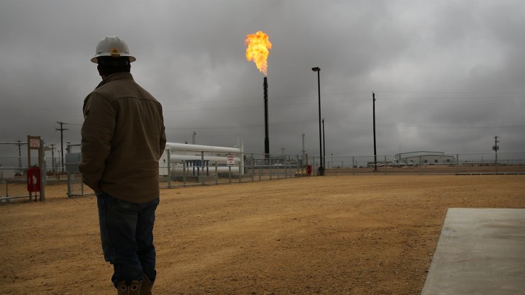 A gas flare burns at a Permian Basin plant. A study found that companies in the region wasted $750 million worth of natural gas in 2018.