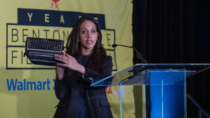 Haben Girma, a disability rights advocate, holds up her BrailleNote keyboard at the Diversity and Inclusion Summit in Bentonville, Arkansas in 2019.