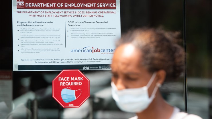 A woman leaves the Department of Employment Services in Washington, D.C. Estimates of unemployment vary depending on the formula and data used.