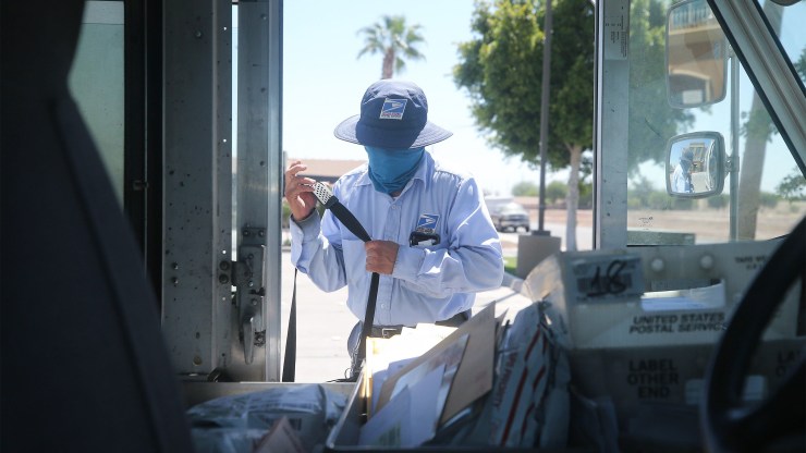 A Postal Service worker on the job in El Centro, California. Leadership changes could affect the workforce's options.