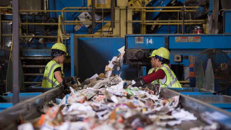 Workers sort recycled materials at a Maryland facility. Compared to pre-pandemic times, more refuse is being generated by homes and less by businesses.