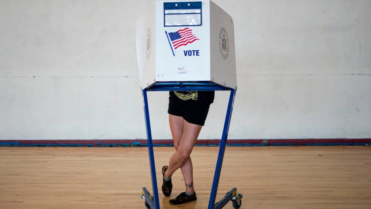 A woman votes at a polling site in Queens during the New York Democratic presidential primary elections on June 23, 2020 in New York City.