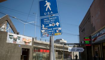 A sign with indications to cross to the United States near El Chaparral pedestrian crossing port in Tijuana, Mexico, on Sept. 1.