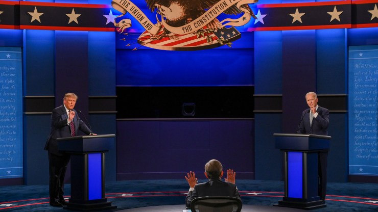 President Donald Trump and Democratic presidential candidate and former Vice President Joe Biden exchange arguments as moderator and Fox News anchor Chris Wallace (center) raises his hands to stop them during the first presidential debate at Case Western Reserve University and Cleveland Clinic in Cleveland, Ohio, on September 29, 2020.