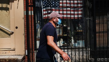 A man walks through a neighborhood on July 07, 2020 in the Brooklyn borough of New York City.