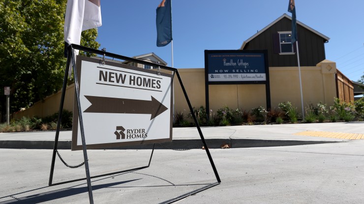 A sign is posted in front of new homes for sale at Hamilton Cottages on September 24, 2020 in Novato, California.