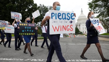 Flight attendants and other aviation workers participate in a march near the U.S. Capitol on Sept. 9 calling for extended airline support.