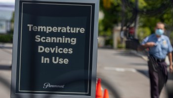 A sign stating that temperature scanning devices are in use at Paramount Pictures Studios..