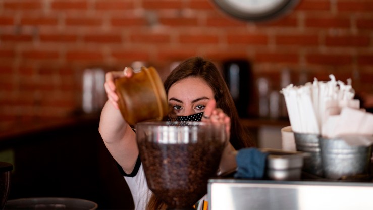 A barista making coffee at an Oklahoma cafe. While 1.4 million new jobs were added in August, employment gains are slowing.