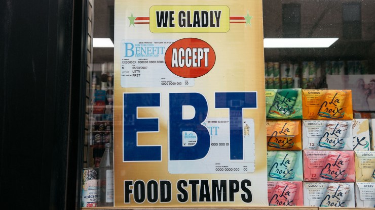 A sign alerting customers about SNAP food stamps benefits is displayed at a Brooklyn grocery store on December 5, 2019 in New York City.