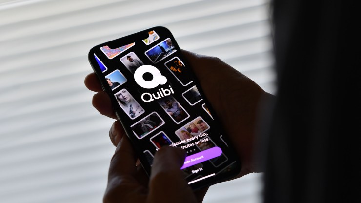 This illustration photo shows a person about to use the Quibi app on a smartphone in Los Angeles, October 21, 2020.
