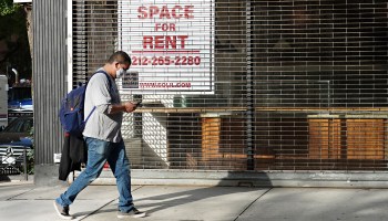 A man wearing a protective mask walks by a closed cafe with a sign in the window reading "Space for Rent" as the city continues reopening efforts following restrictions imposed to slow the spread of coronavirus on October 19, 2020 in New York City.