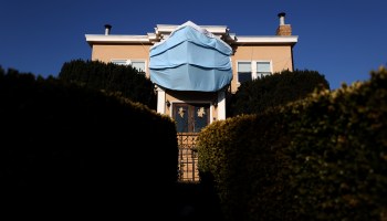 A large custom-made surgical mask is displayed on the front of a home on Oct. 23 in San Francisco.