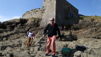 The owner of the Fort du Petit, available for rent on Airbnb, walks in front of the 17th century military fortress in northwestern France.