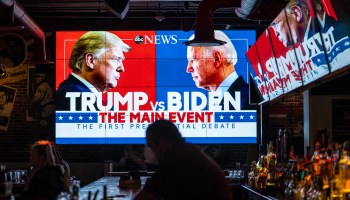 Television screens air the first presidential debate at a sports bar on Sept. 29, in Washington, D.C.
