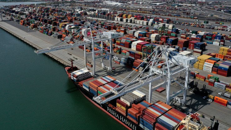 A container ship sits at the Port of Oakland in Northern California.