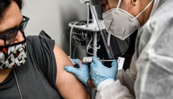 A volunteer receives a COVID-19 vaccination in a trial at the Research Centers of America in Hollywood, Florida, last month.