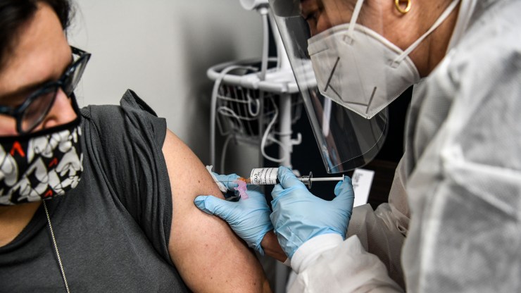 A volunteer receives a COVID-19 vaccination in a trial at the Research Centers of America in Hollywood, Florida, last month.
