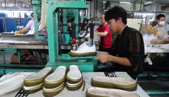 Workers at the Changjian Shoe factory are pictured.