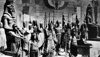 1923: A scene from silent version of the epic film 'The Ten Commandments', also directed by Cecil B DeMille. The Egyptian Pharaoh is surrounded by his guards as he prepares to lead his army forth. (Photo by Topical Press Agency/Getty Images)