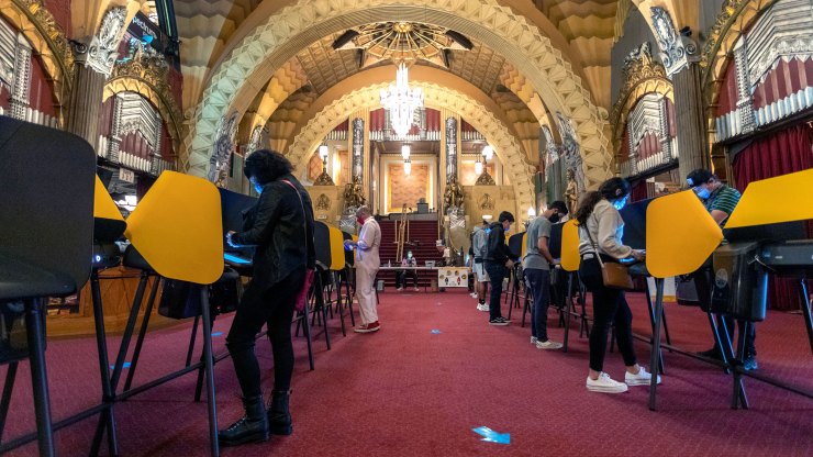 Californians cast their votes inside the historic Hollywood Pantages Theatre on Nov. 3 in Los Angeles.