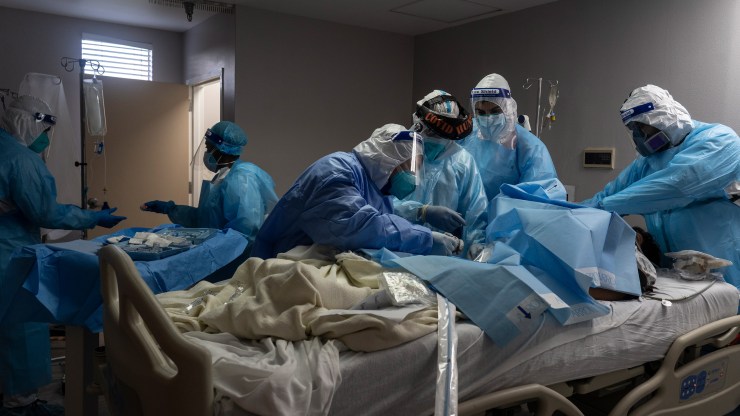 Medical staff members treat a patient suffering from coronavirus in the COVID-19 intensive care unit at the United Memorial Medical Center on Nov. 10 in Houston, Texas.