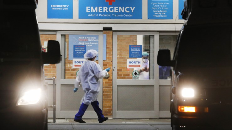 Medical workers walk outside of a special coronavirus intake area at a hospital in Brooklyn earlier this year.