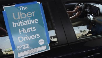 A ride share driver participates in a protest against Proposition 22 in August in Los Angeles, California.