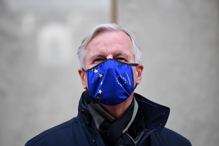 EU chief Brexit negotiator Michel Barnier, wearing an EU flag-themed face mask due to the coronavirus pandemic, leaves the conference center in London on October 28, 2020 to return to his hotel.