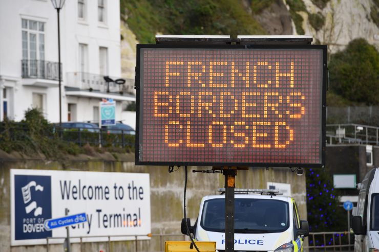 A sign informs drivers that the French border crossing is closed at the cordoned entrance to the ferry terminal at the Port of Dover in Kent, south east England on December 22, 2020, after France closed its borders to accompanied freight arriving from the U.K. due to the rapid spread of a new coronavirus strain.