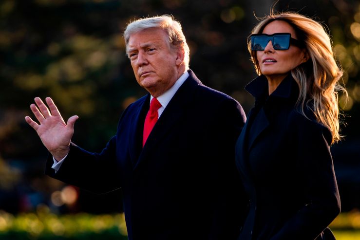 President Donald Trump and First Lady Melania Trump walk towards Marine One as they depart the White House en route to Mar-a-Lago, the president's private club, where they will spend Christmas and New Years Eve on Dec. 23, 2020.