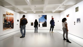 Visitors attend an art exhibition at the Barbican gallery in London. Blake Gopnik calls galleries safe places to contemplate art, contrasting them with more sales-driven and crowded art fairs. "No one is lamenting the death of the art fair," he says.