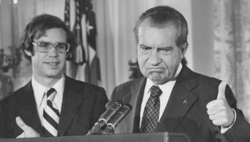 Richard Nixon gives the thumbs up as he addresses the White House staff upon his resignation as 37th President of the United States, Washington, D.C., in 1974. His son-in-law, David Eisenhower, is with him on the left.