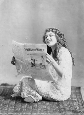 circa 1910: Mary Pickford reading a pamphlet in support of suffragettes. (Photo by Hulton Archive/Getty Images)
