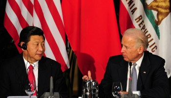 Xi Jinping and Joe Biden talk during a meeting of governors in Los Angeles in 2012.