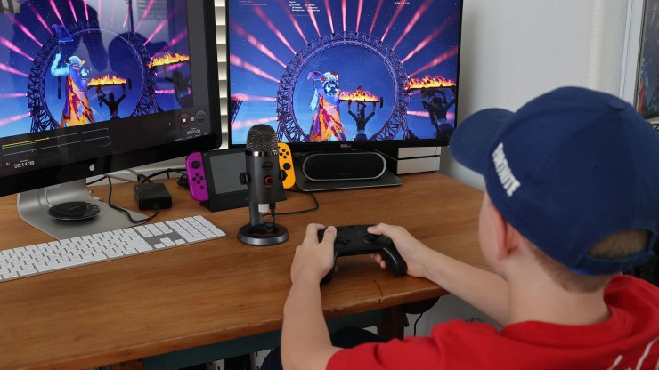 An 11-year-old boy plays Fortnite, featuring Travis Scott Presents: Astronomical, on April 23, 2020, in South Pasadena, California.